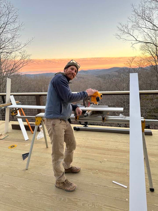 A Man installing his Cable Railing