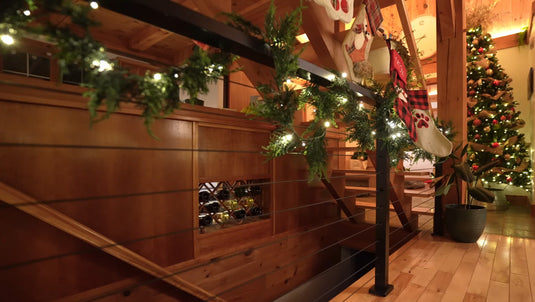 Cable railing decorated with Christmas lights