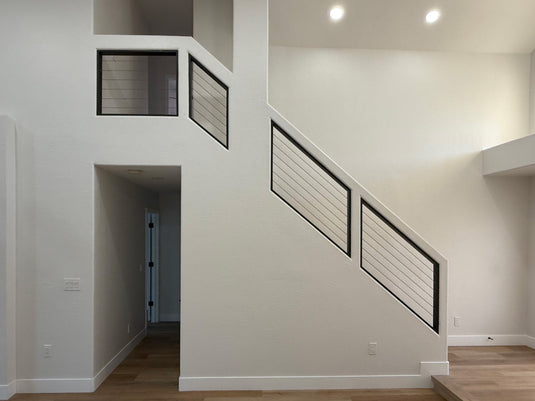 Modern Interior Staircase with Black Cable Stair Railing