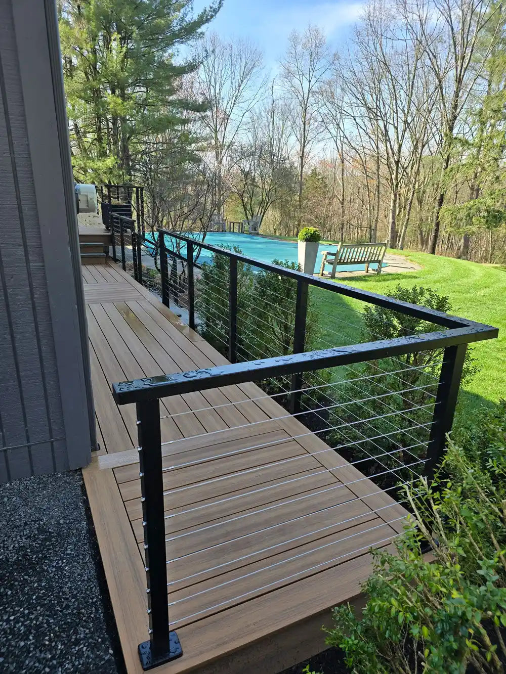 cable-deck-railings-on-a-tranquil-outdoor-area-with-trees