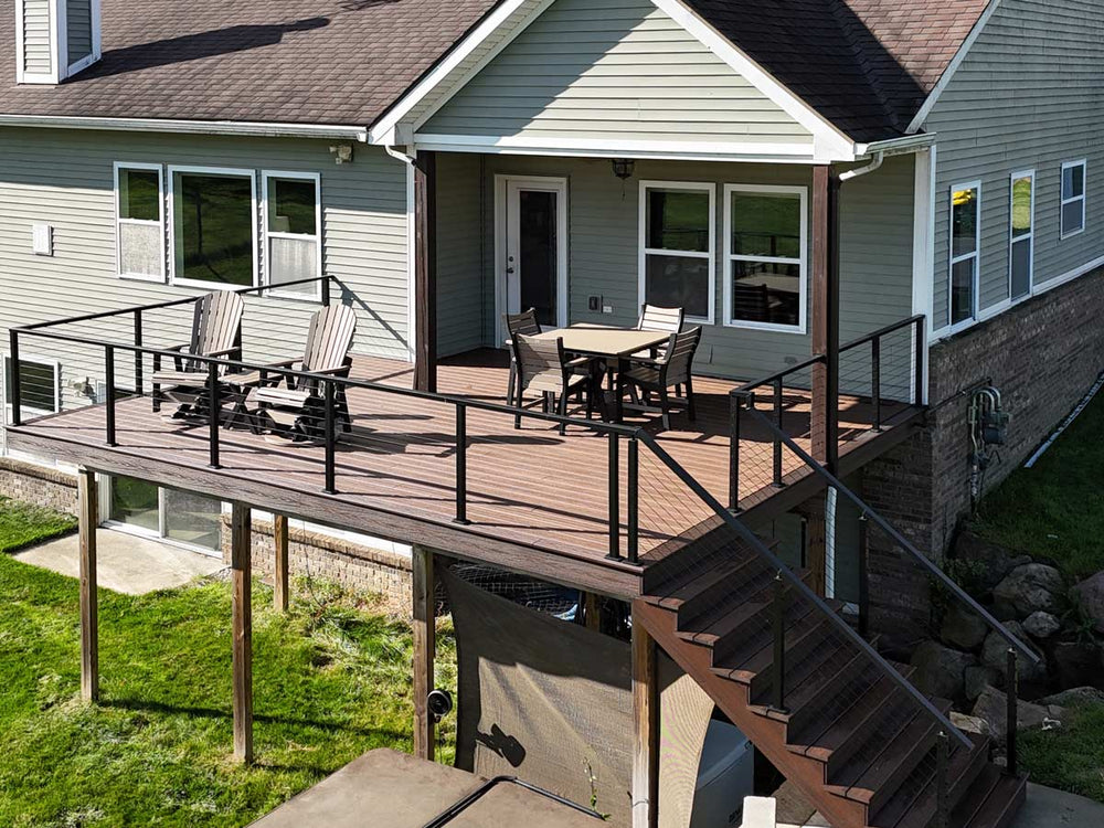 elevated deck wire railing with brown composite decking and black cable system overlooking pond in michigan