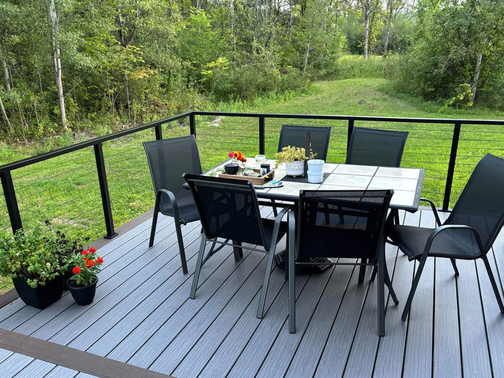 forest view wood deck with black railing