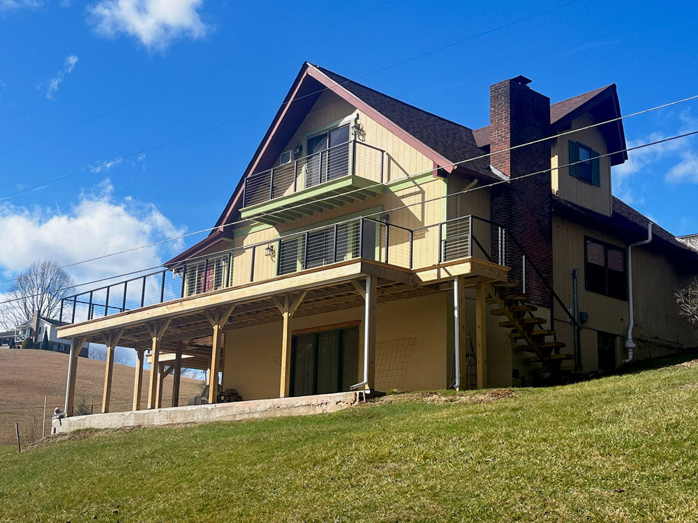 graham-marshall-deck-with-wire-deck-railing-and-hillside-view
