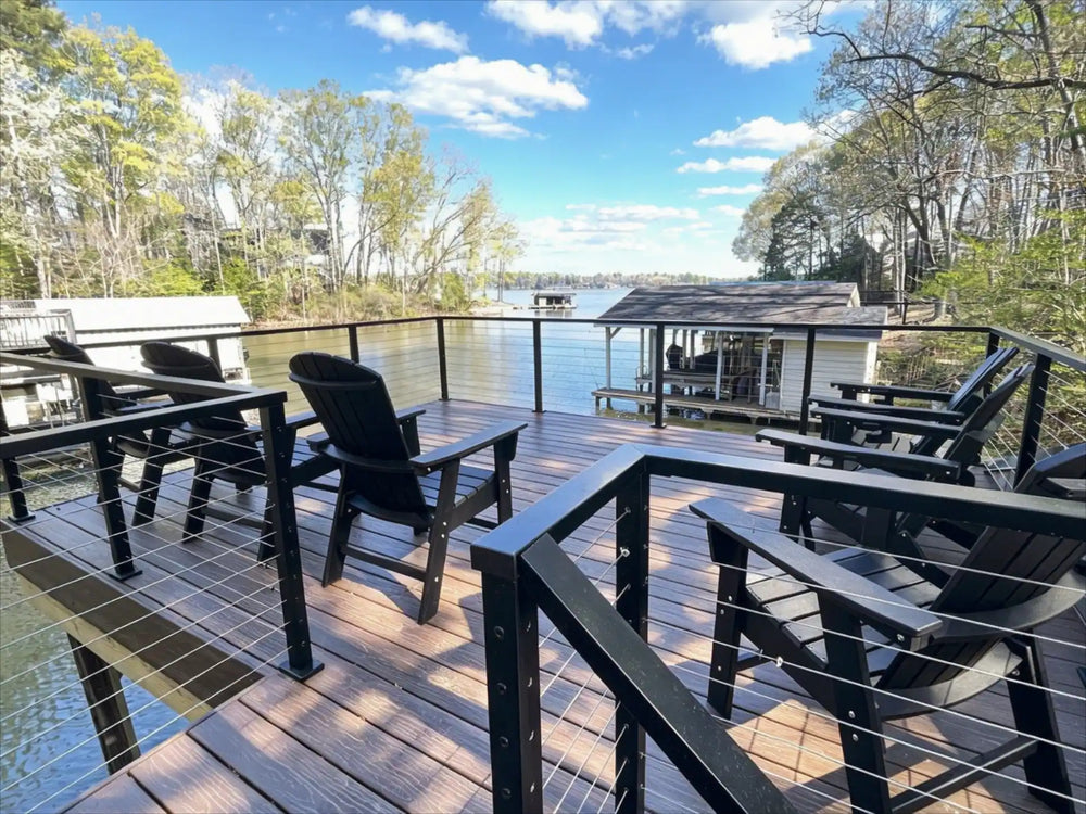 Black cable railing system creating an open and relaxing waterfront living space 