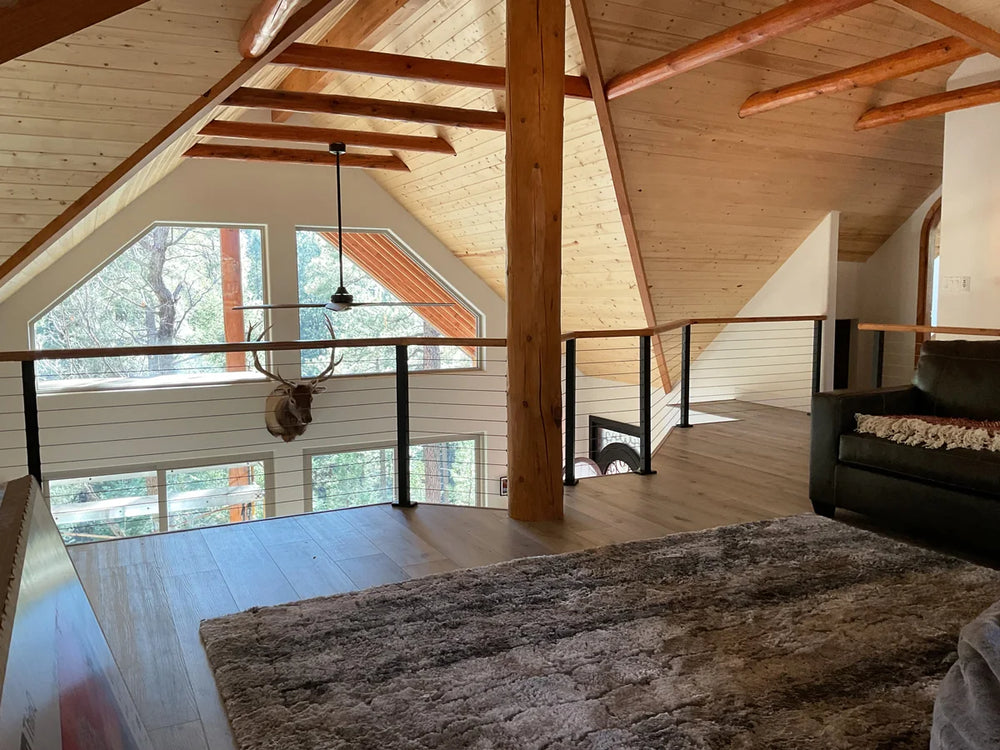 modern loft balcony with cable rail systems and large windows