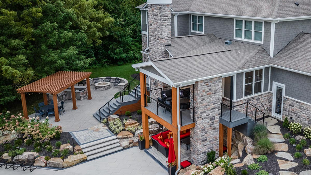 multi-level outdoor living space with cable railing system connecting decks and patio areas