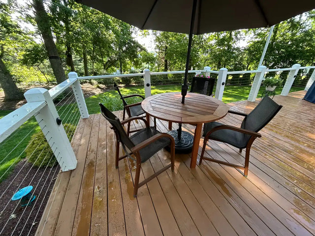 outdoor-deck-with-cable-railing-and-wood-accents.webp