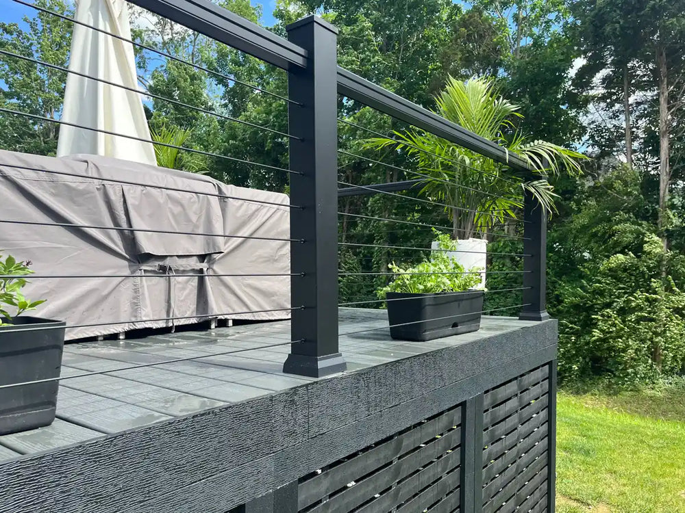 refined wooden deck railing with cables highlighting kentucky greens