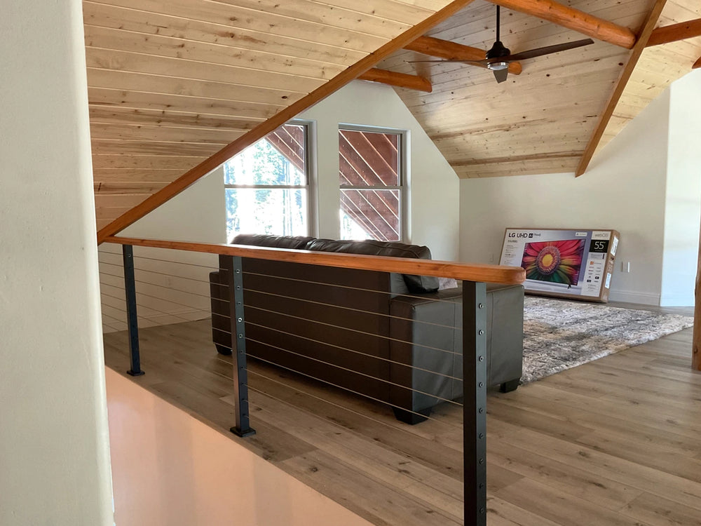 rustic arizona loft with cable rail systems and leather sofa