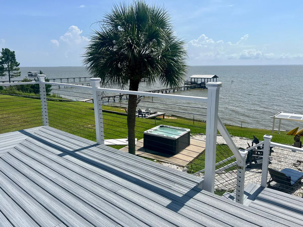 side view of house with cable railing with wood posts
