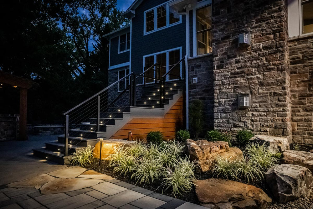 softly lit outdoor stairs with a cable railing system at night