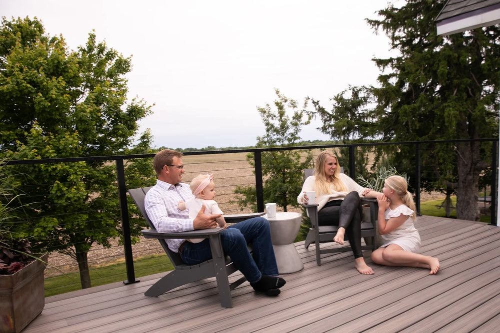 soothing-outdoor-retreat-with-black-cable-railing-and-green-landscape