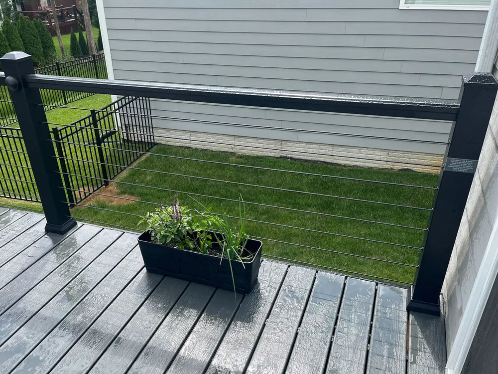 sturdy wooden deck railing with cable infill and planters in kentucky