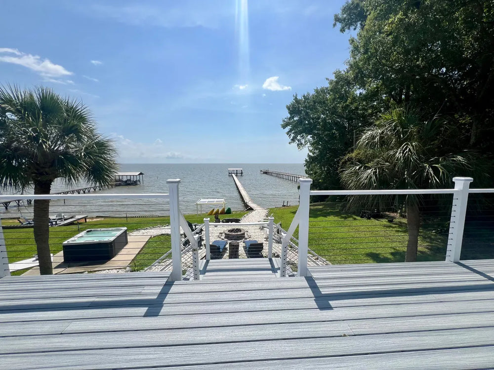 waterfront deck with cable railing with wood posts